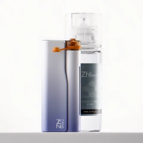 Zhithera D1 waterless nebulizing diffuser beside a 100 ml fragrance oil bottle on a white background