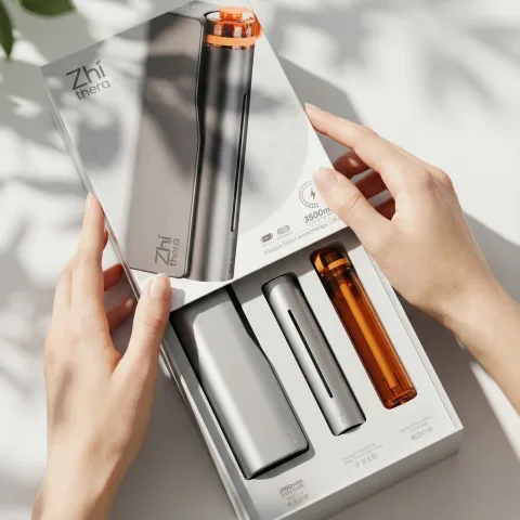 Zhithera D1 waterless diffuser gift box opened to show the device and refillable cartridges