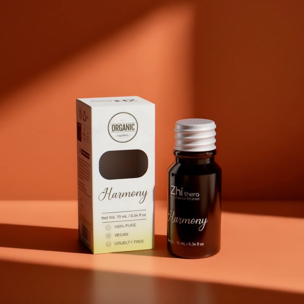 Zhithera 10 ml essential oil bottle and box labeled "Harmony" on an orange background