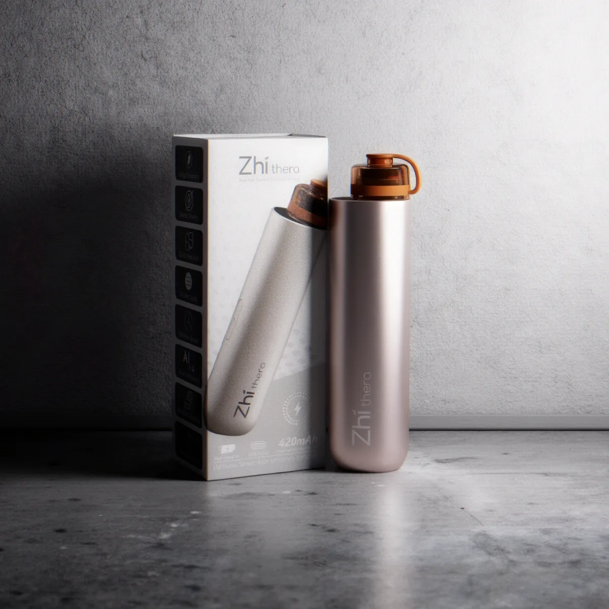 Silver and rose Zhithera D1 Mini diffusers beside their retail box on concrete